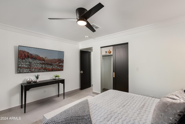 bedroom with ceiling fan and crown molding