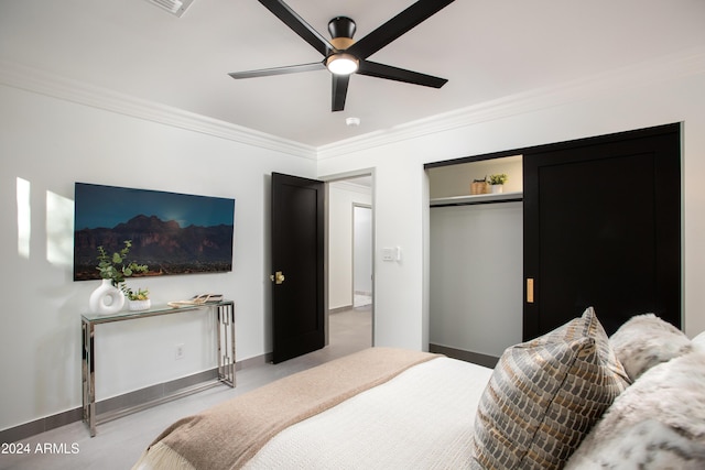 bedroom featuring a closet, ceiling fan, and ornamental molding