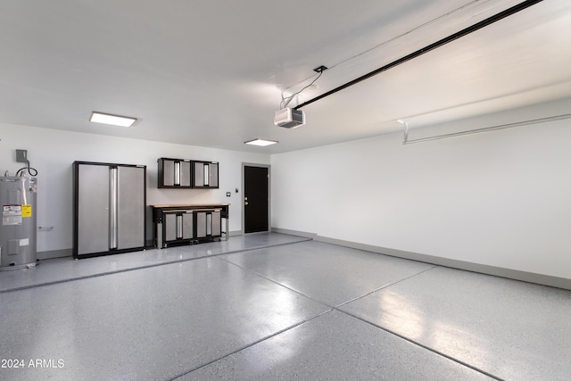 garage featuring a garage door opener and water heater