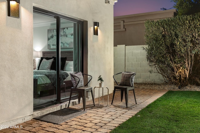 view of patio terrace at dusk