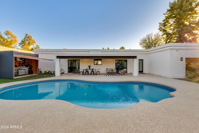 view of swimming pool featuring a patio