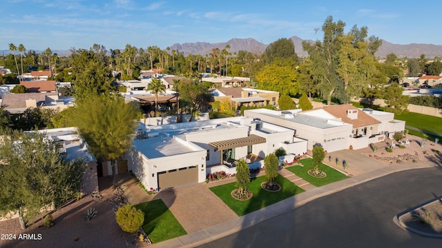 birds eye view of property with a mountain view