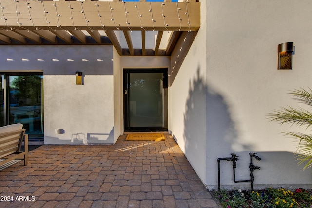 doorway to property with a patio