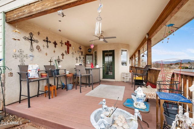 wooden terrace with ceiling fan