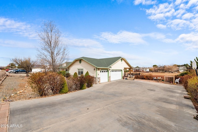 view of front of home with a garage and driveway
