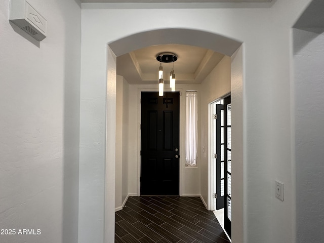 interior space featuring a raised ceiling