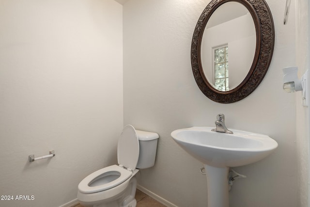 bathroom featuring tile patterned floors and toilet