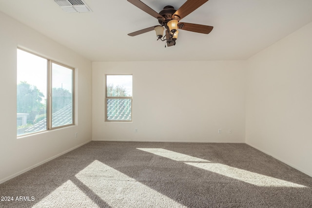 unfurnished room featuring carpet and ceiling fan