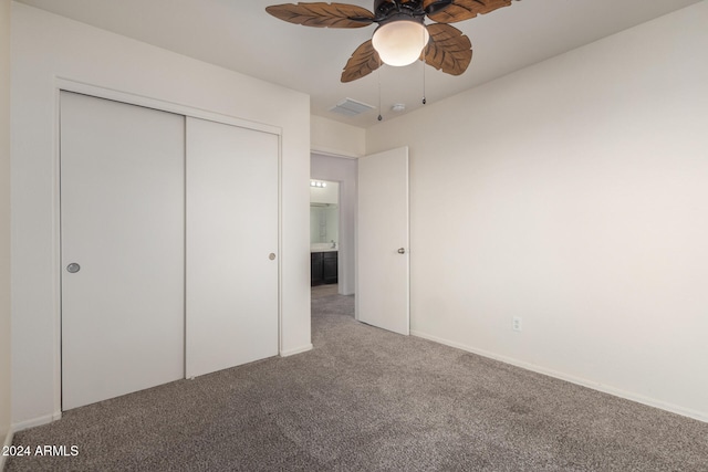 unfurnished bedroom featuring ceiling fan, a closet, and carpet floors