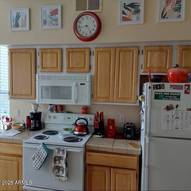 14950 W Mountain View Blvd Unit 5303, Surprise, AZ 85374 - kitchen with white appliances and tile counters