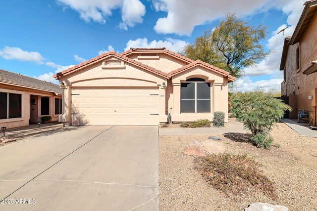 21640 N 48th St, Phoenix, AZ 85054 - view of front of property featuring driveway, an attached garage, a tiled roof, and stucco siding
