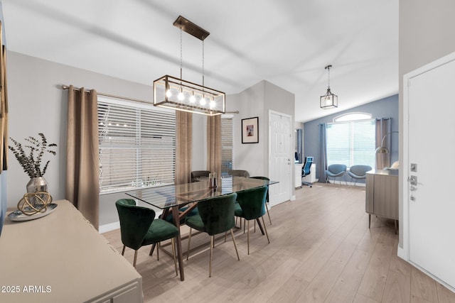 21640 N 48th St, Phoenix, AZ 85054 - dining area featuring light wood-type flooring, baseboards, and lofted ceiling