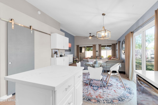 21640 N 48th St, Phoenix, AZ 85054 - kitchen featuring a barn door, dishwasher, open floor plan, white cabinetry, and a notable chandelier