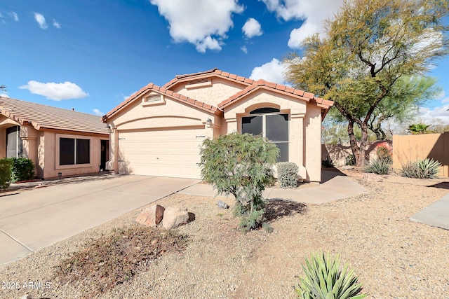 21640 N 48th St, Phoenix, AZ 85054 - mediterranean / spanish-style house with a tile roof, stucco siding, fence, a garage, and driveway