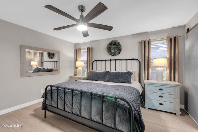 21640 N 48th St, Phoenix, AZ 85054 - bedroom featuring light wood finished floors, baseboards, and a ceiling fan