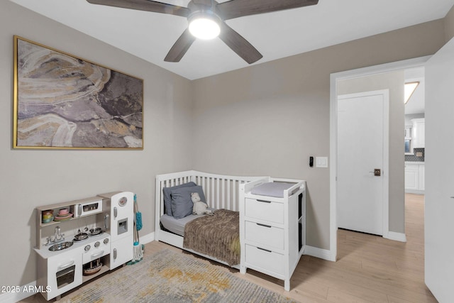 21640 N 48th St, Phoenix, AZ 85054 - bedroom featuring light wood finished floors, baseboards, and a ceiling fan