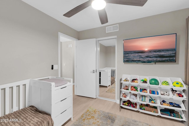 21640 N 48th St, Phoenix, AZ 85054 - bedroom with visible vents, ceiling fan, and wood finished floors