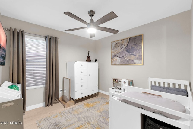 21640 N 48th St, Phoenix, AZ 85054 - bedroom featuring light wood finished floors, multiple windows, and baseboards