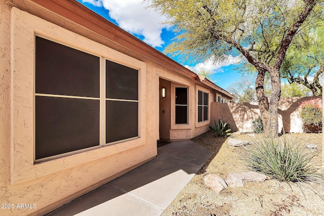 21640 N 48th St, Phoenix, AZ 85054 - view of side of home featuring fence and stucco siding