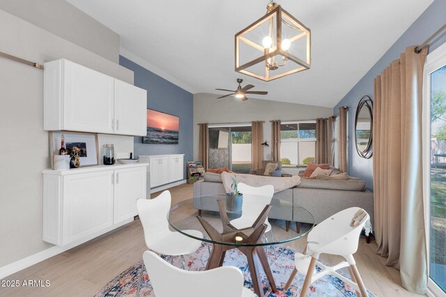 21640 N 48th St, Phoenix, AZ 85054 - dining space featuring light wood-type flooring, baseboards, ceiling fan with notable chandelier, and lofted ceiling