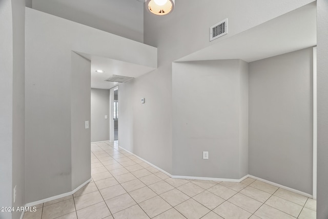 empty room featuring light tile patterned floors