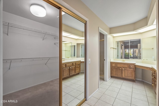 bathroom with tile patterned flooring and vanity