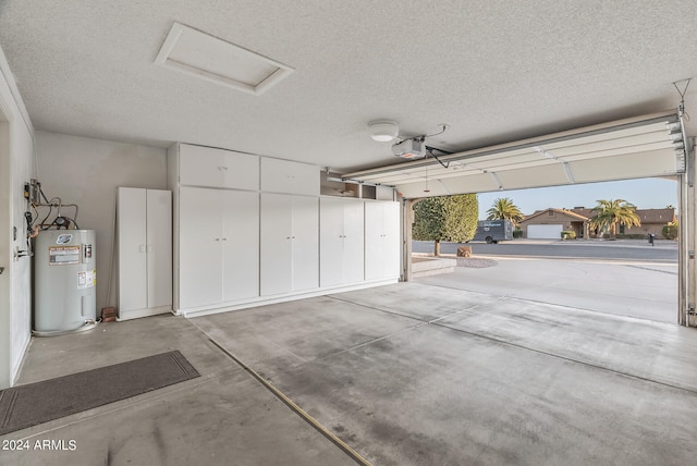 garage featuring a garage door opener and electric water heater