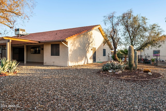 back of house featuring a patio and central AC