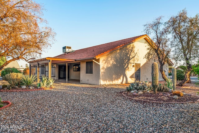 rear view of property featuring a patio