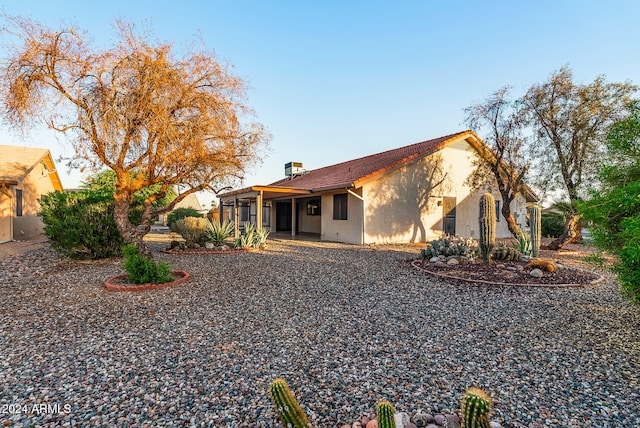 back of property featuring a patio