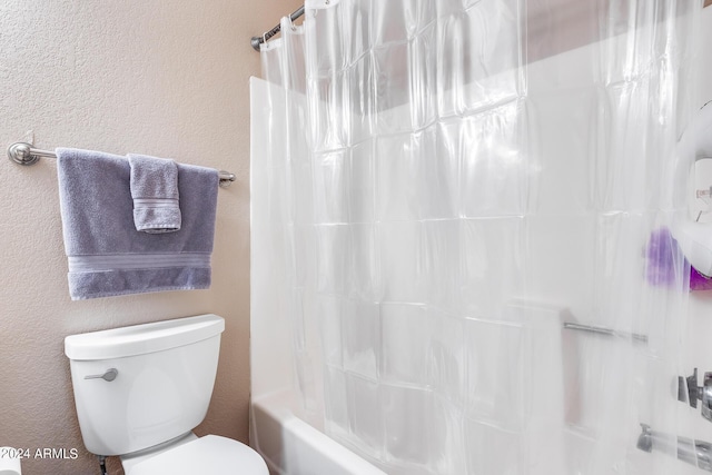 bathroom with toilet and shower / bath combo with shower curtain