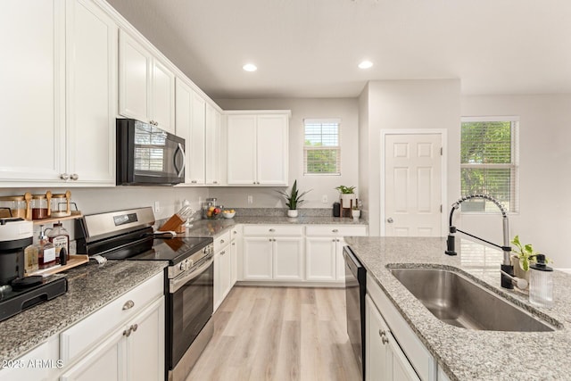 263 N Wilson Dr, Chandler, AZ 85225 - kitchen featuring electric range, black microwave, white cabinets, light stone counters, and recessed lighting