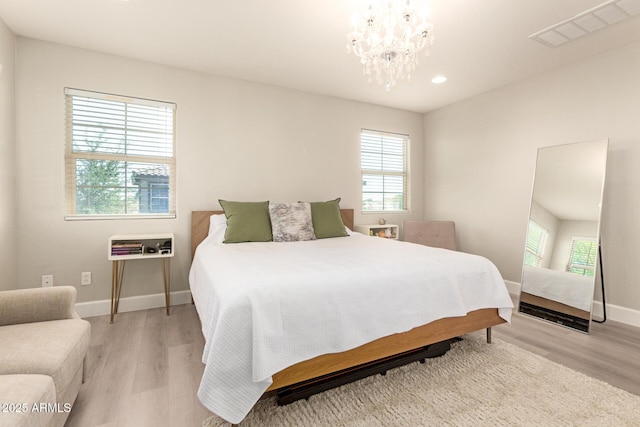 263 N Wilson Dr, Chandler, AZ 85225 - bedroom featuring light wood-style flooring, recessed lighting, and a chandelier