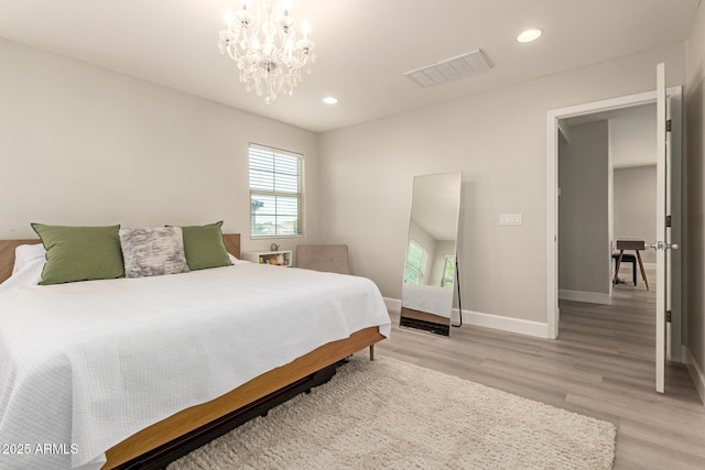 263 N Wilson Dr, Chandler, AZ 85225 - bedroom with multiple windows, light wood-style floors, recessed lighting, and a chandelier