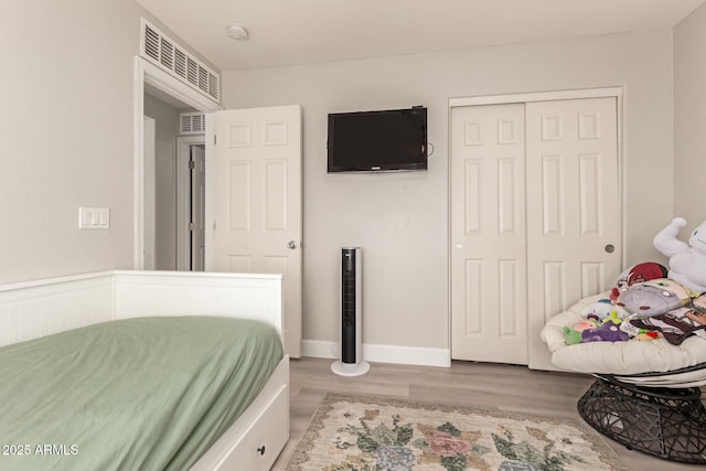 263 N Wilson Dr, Chandler, AZ 85225 - bedroom with wood finished floors and a closet