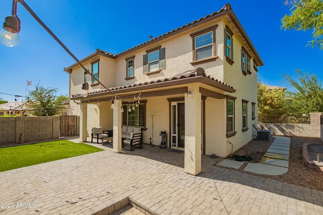 263 N Wilson Dr, Chandler, AZ 85225 - back of house featuring stucco siding, a tile roof, a fenced backyard, a patio, and an outdoor living space