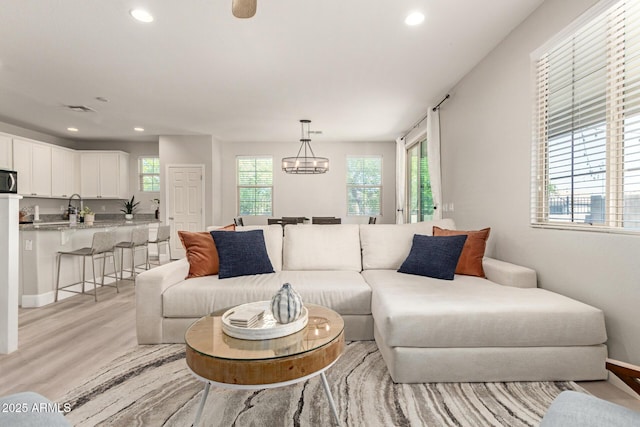 263 N Wilson Dr, Chandler, AZ 85225 - living area featuring light wood-type flooring, recessed lighting, and a chandelier