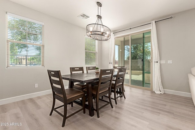 263 N Wilson Dr, Chandler, AZ 85225 - dining space with plenty of natural light, a chandelier, and light wood finished floors
