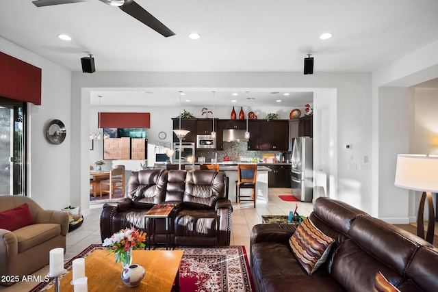 tiled living room featuring ceiling fan