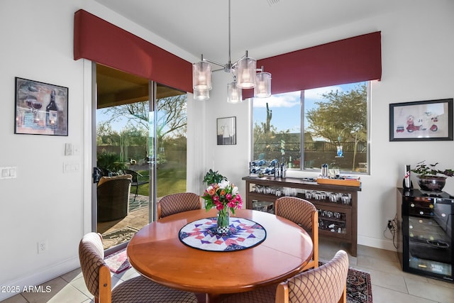 tiled dining room featuring wine cooler