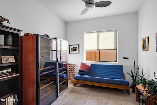 sitting room featuring ceiling fan and light tile patterned floors