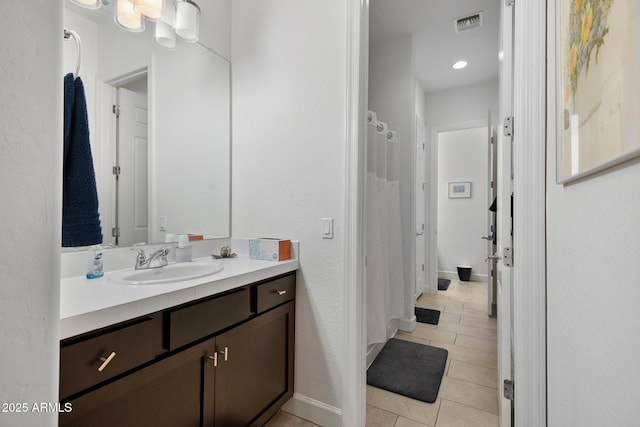 bathroom featuring tile patterned floors and vanity