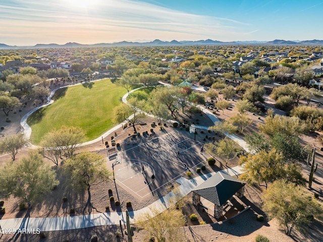 aerial view at dusk featuring a mountain view