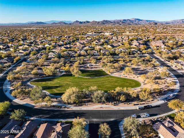 birds eye view of property with a mountain view