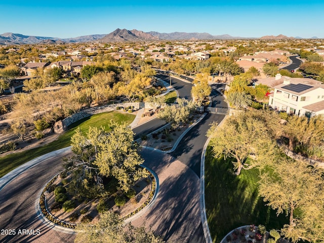 birds eye view of property with a mountain view