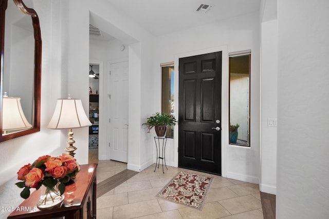 entryway with light tile patterned floors