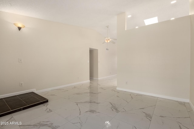 643 W Medina Ave, Mesa, AZ 85210 - empty room featuring ceiling fan, light marble finish flooring, baseboards, and lofted ceiling