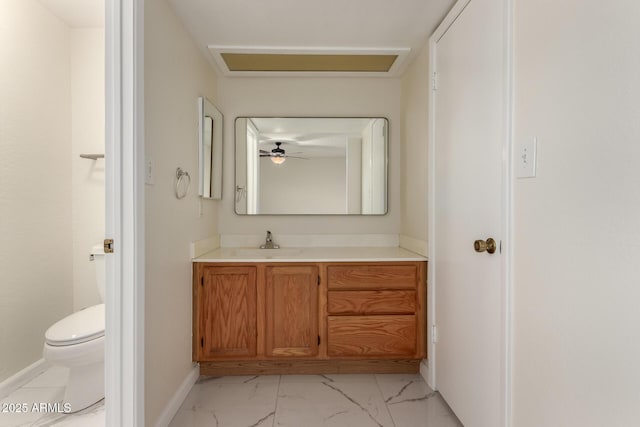 643 W Medina Ave, Mesa, AZ 85210 - bathroom with marble finish flooring, toilet, vanity, and baseboards