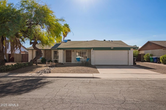 643 W Medina Ave, Mesa, AZ 85210 - ranch-style house with a garage, concrete driveway, and stucco siding