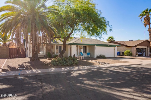 643 W Medina Ave, Mesa, AZ 85210 - ranch-style home with stucco siding, a garage, and concrete driveway
